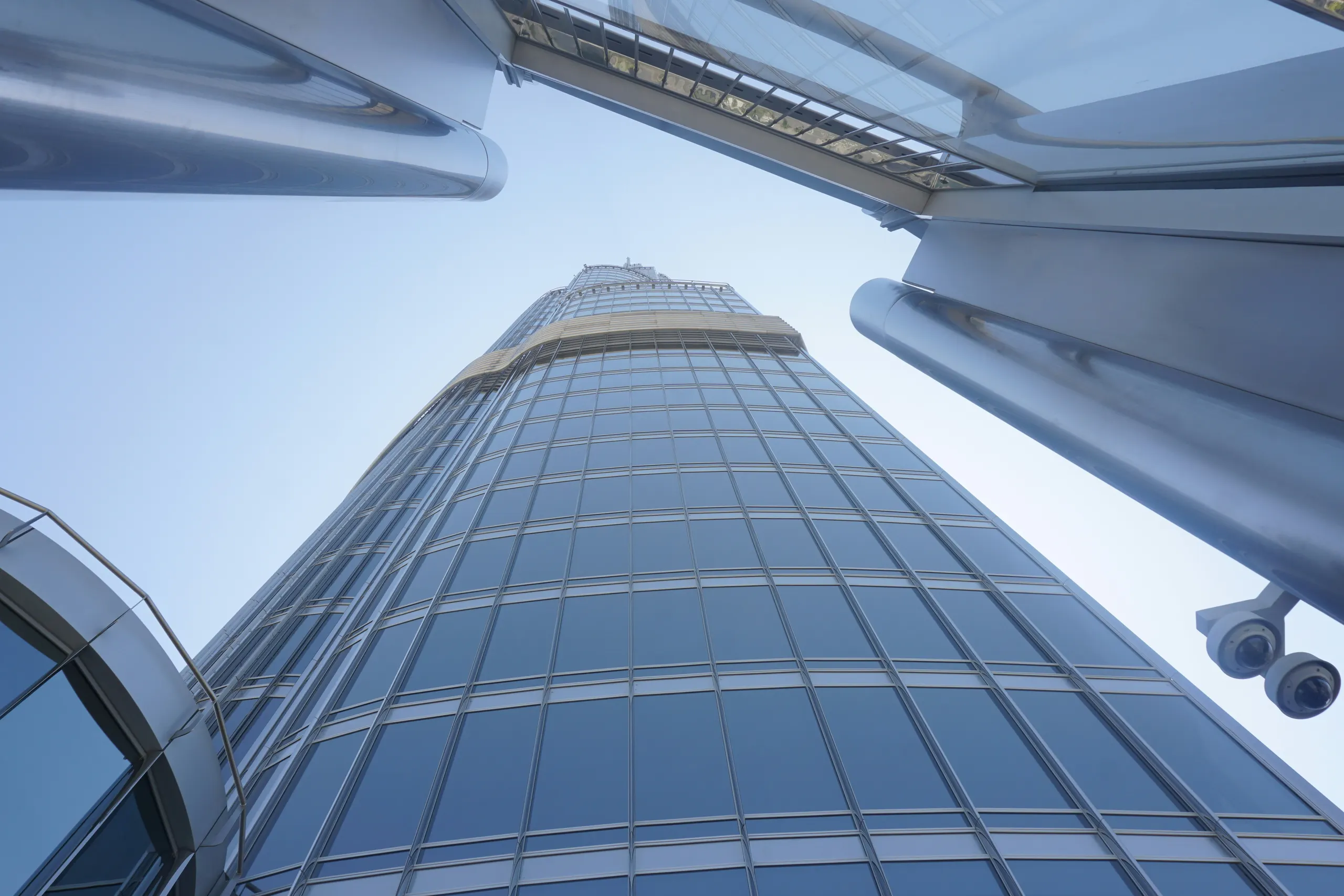 Glass facade of a Dubai tower seen from below