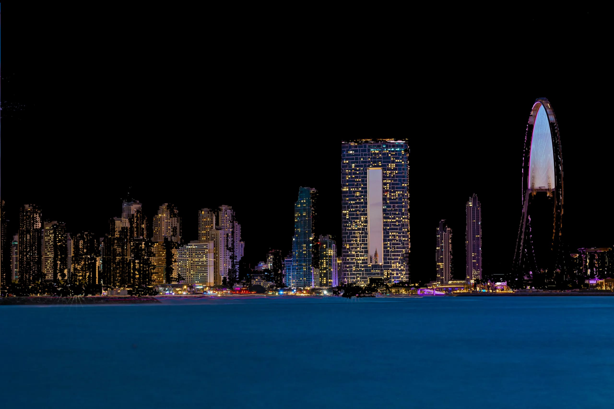 Dubai skyline towers at dusk along the water